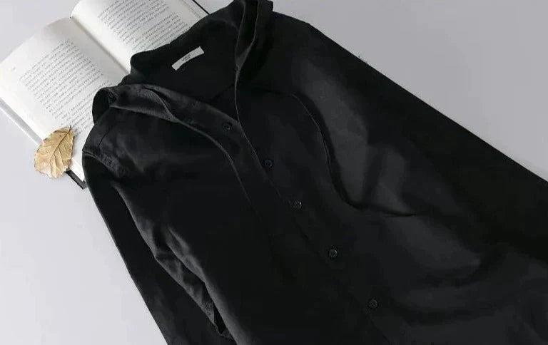 Unisex hooded shirt in lightweight fabric, showcasing breathable material and casual design with versatile unisex fit.