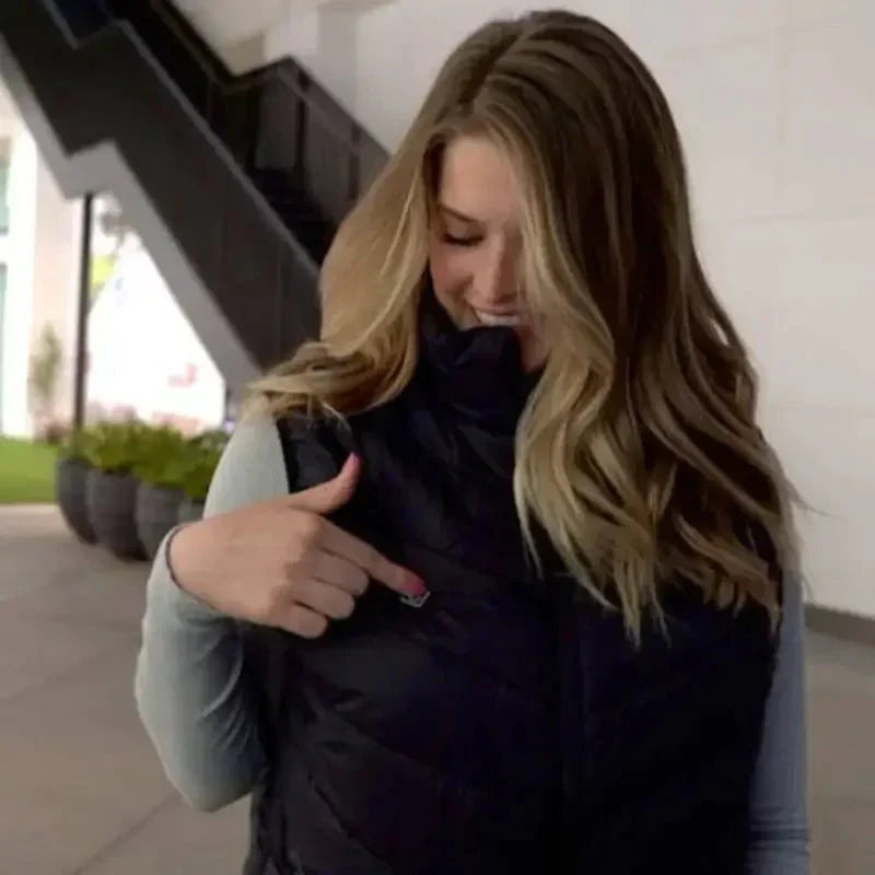 Unisex Thermo Heated Gilet front view; sleek black, advanced heating, ideal for cold weather, sports & fitness warmth.