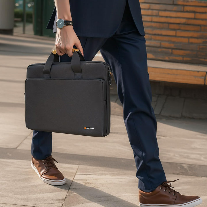 Durable unisex laptop sleeve within a water-resistant shoulder bag, 360° protective.