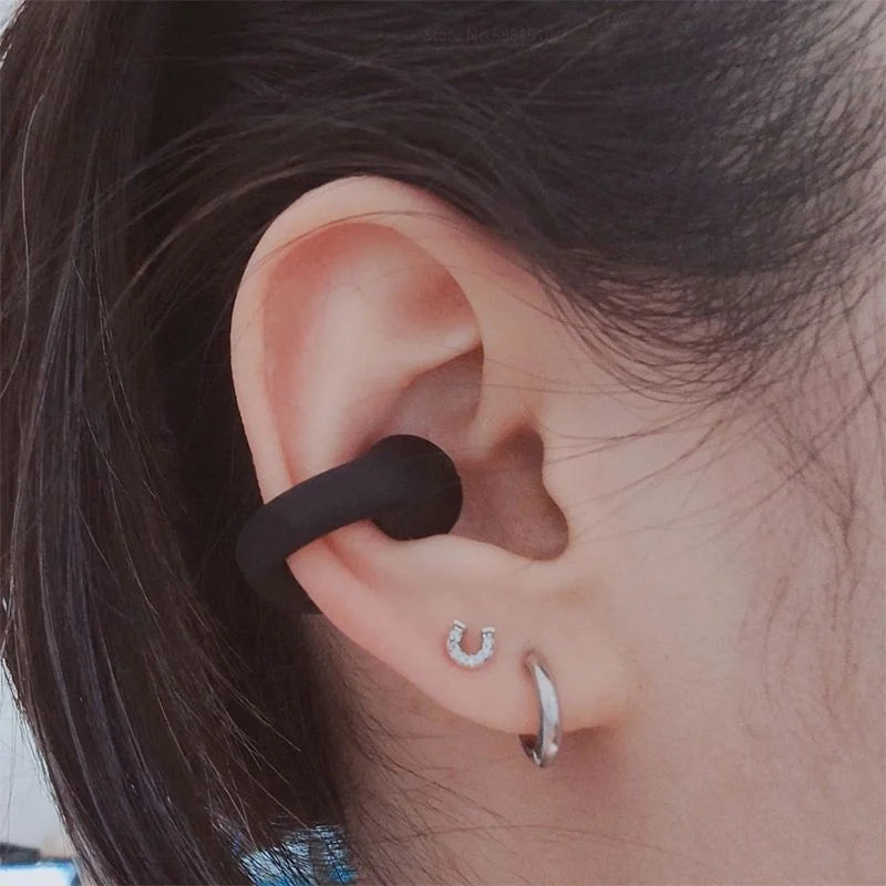 Unisex wireless bone conduction earphones. Open-ear design for comfortable sports, running, and workouts with clear audio.