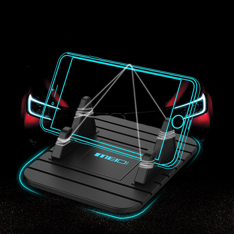 Universal non-slip phone holder for cars with silicone grip, securely holding a smartphone on a dashboard for safe driving.