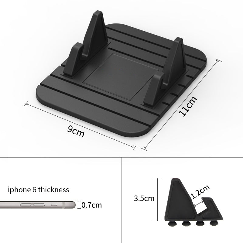 Universal non-slip phone holder for cars with silicone grip, securely holding a smartphone on a dashboard for safe driving.
