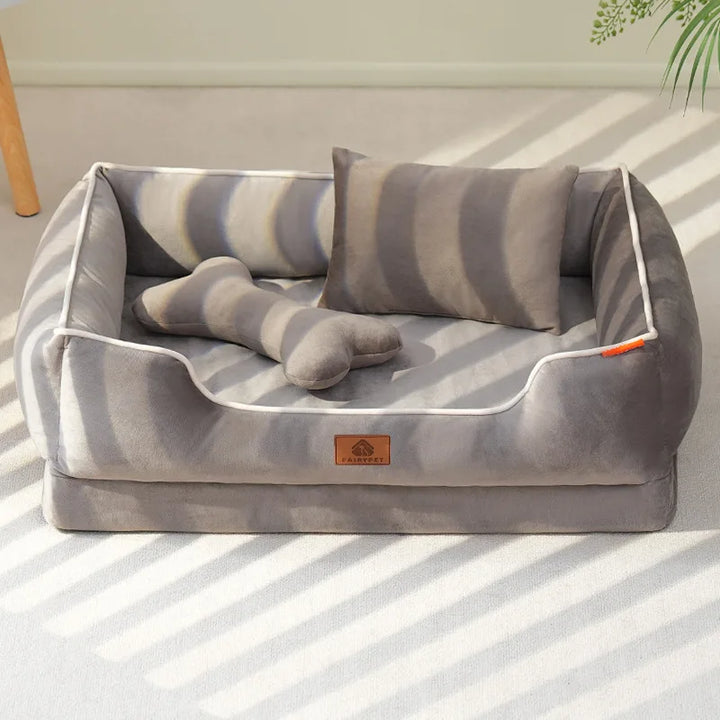 "Velvet-soft pet bed with cushion and bolster, shown in modern living room, offers comfort with Dutch velvet texture."
