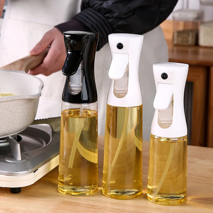 "Versatile refillable oil spray bottle, transparent body, fine mist spray, eco-friendly plastic, ideal for home chefs and coo