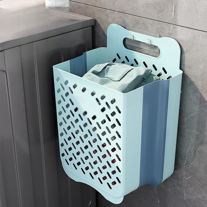 "Wall-mounted foldable laundry basket with breathable mesh design, shown unfolded and mounted on a wall for space-saving use.