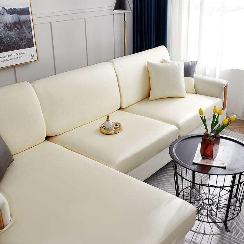 "Waterproof sectional sofa cover in smoke grey, sleek design for leather protection, durable stretchable fabric, snug fit."