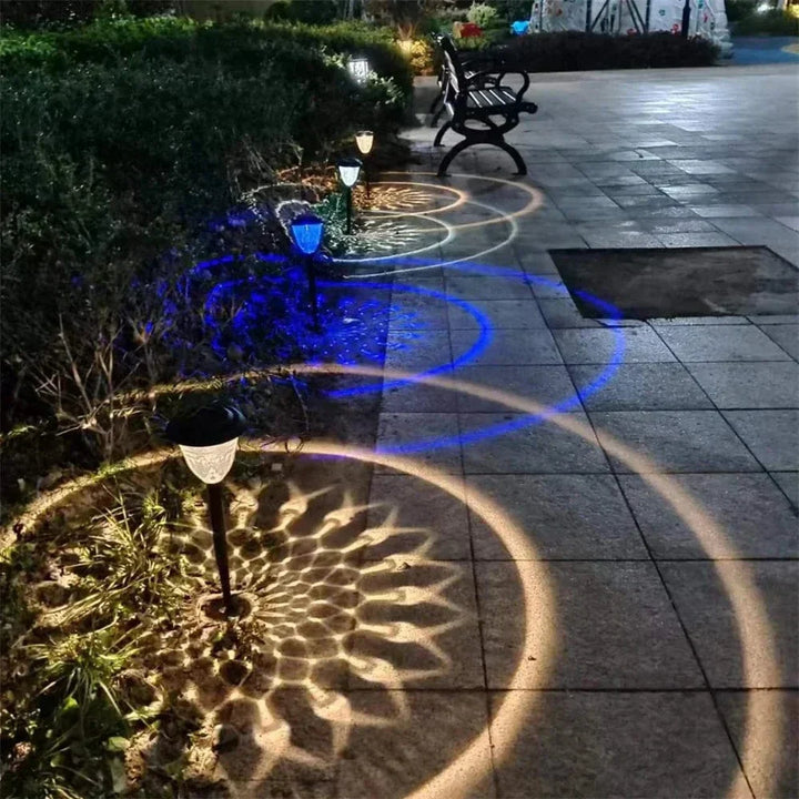 Weatherproof garden light casting intricate mandala shadows, solar-powered, LED, IP65 waterproof, enhances outdoor decor.