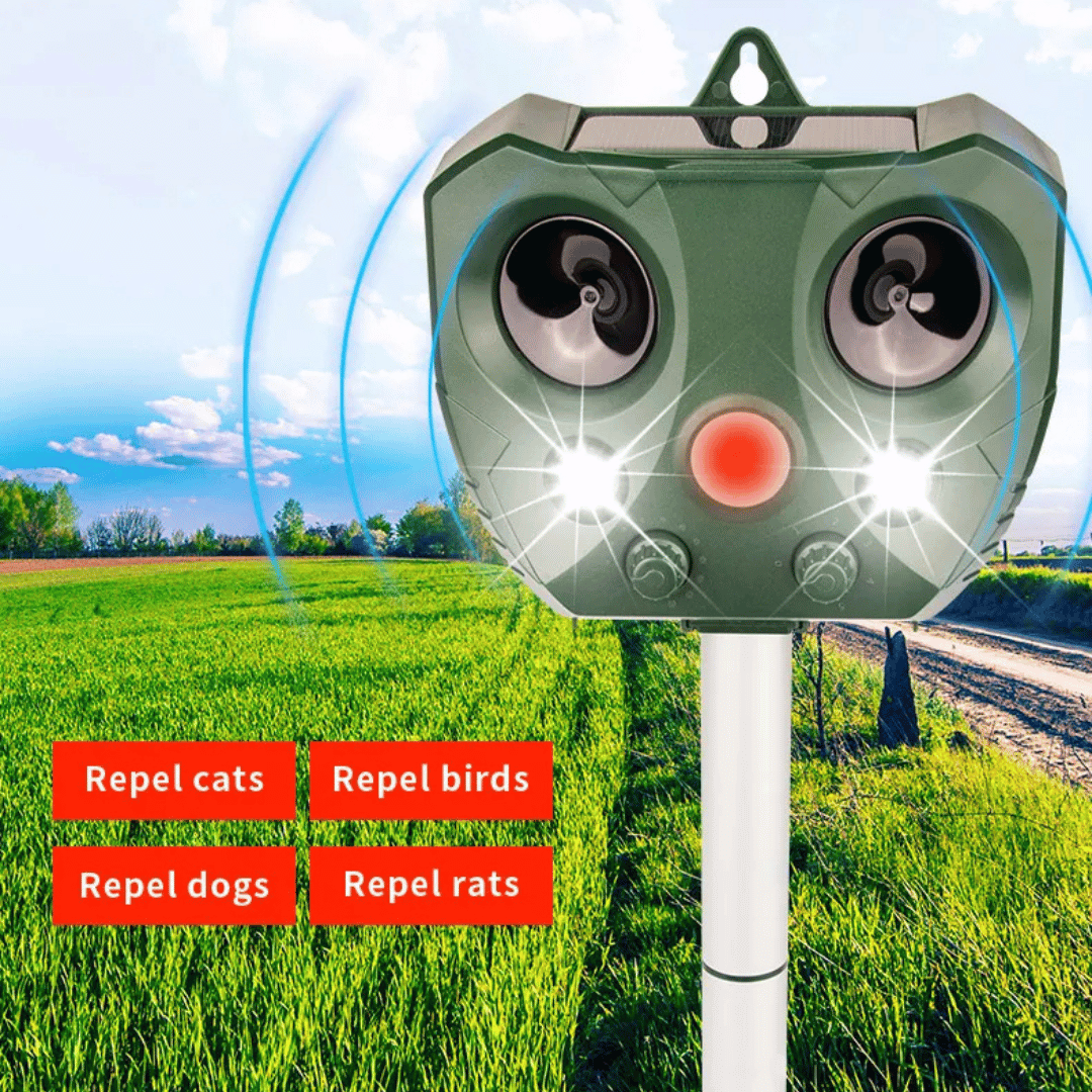 "Weatherproof solar ultrasonic animal repeller in garden, motion-activated to deter pests like cats and rodents."