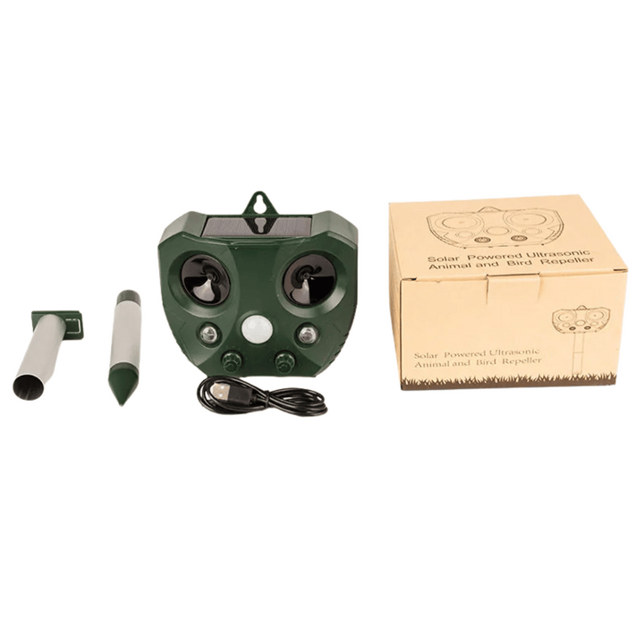 "Weatherproof solar ultrasonic animal repeller in garden, motion-activated to deter pests like cats and rodents."