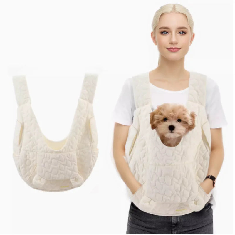 White hands-free pet carrier for small dogs. Comfortable, breathable dog sling bag for travel. Unisex design.
