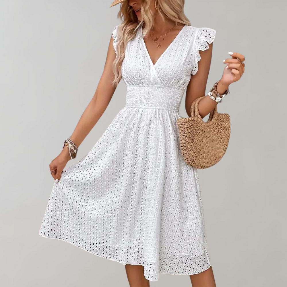 White midi summer dress for women with elegant ruffled short sleeves. Perfect for casual or vacation wear.
