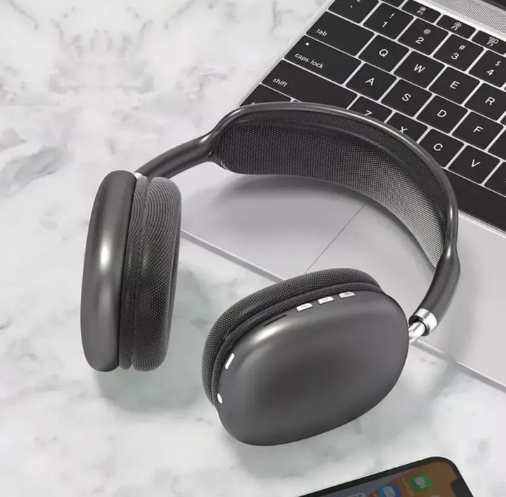 Wireless Bluetooth over-ear headphones, sleek black design, ergonomic fit, featuring noise cancellation and soft cushions.