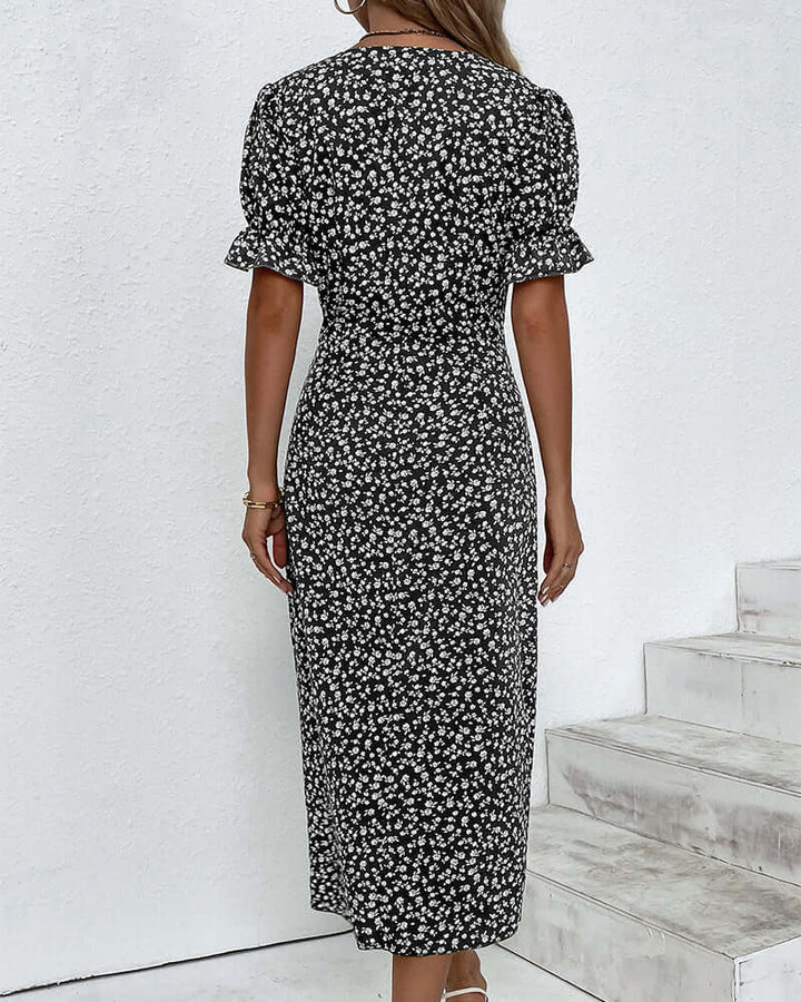 "Woman wearing elegant button-front dress in assorted colors with a flattering silhouette and classic style."