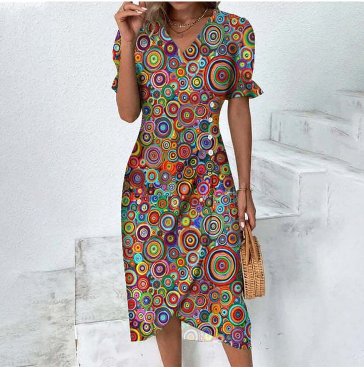"Woman wearing elegant button-front dress in assorted colors with a flattering silhouette and classic style."