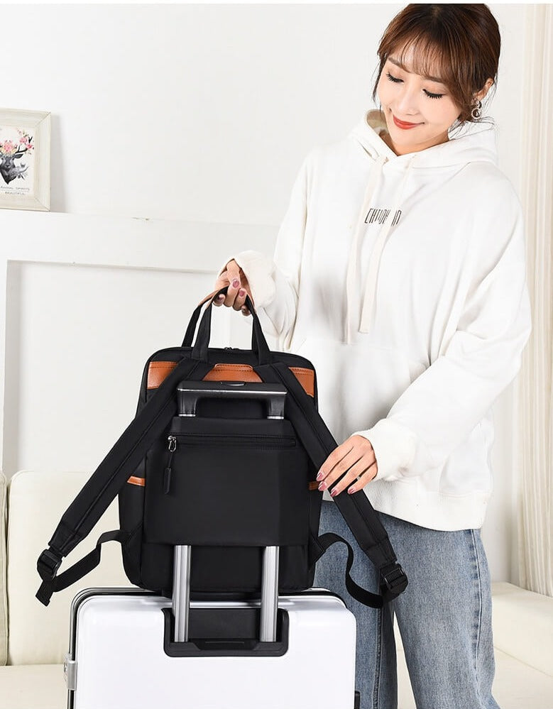 Women's water-resistant anti-theft school bag with secure compartments. Ideal for students.
