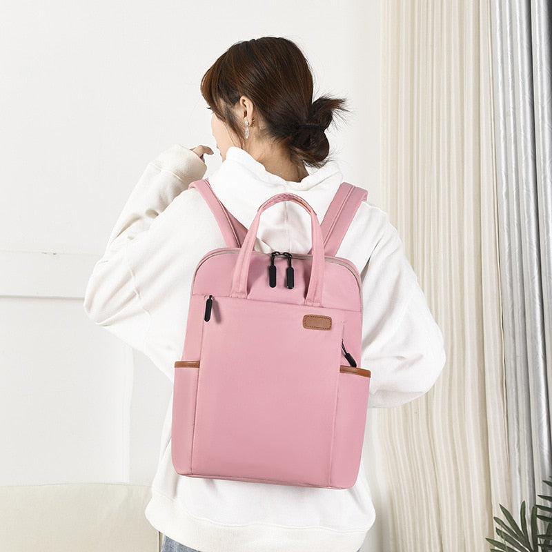 Women's daily anti-theft backpack, water-resistant Oxford material. Secure for commute.