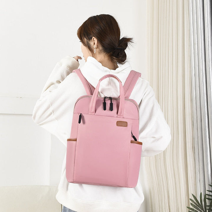 Women's daily anti-theft backpack, water-resistant Oxford material. Secure for commute.