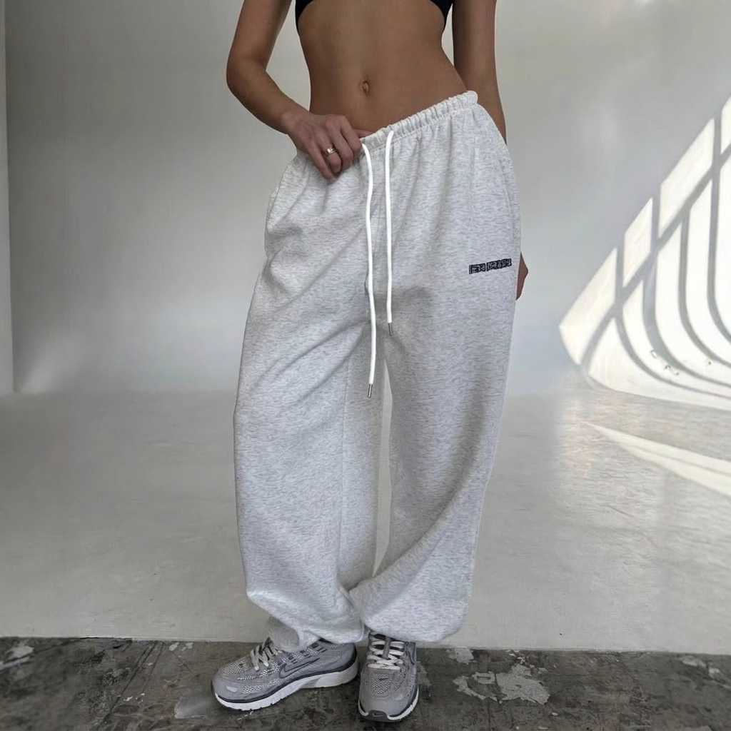 Women's athleisure sweatpants, baggy wide leg fit with a trendy side stripe & comfortable design.
