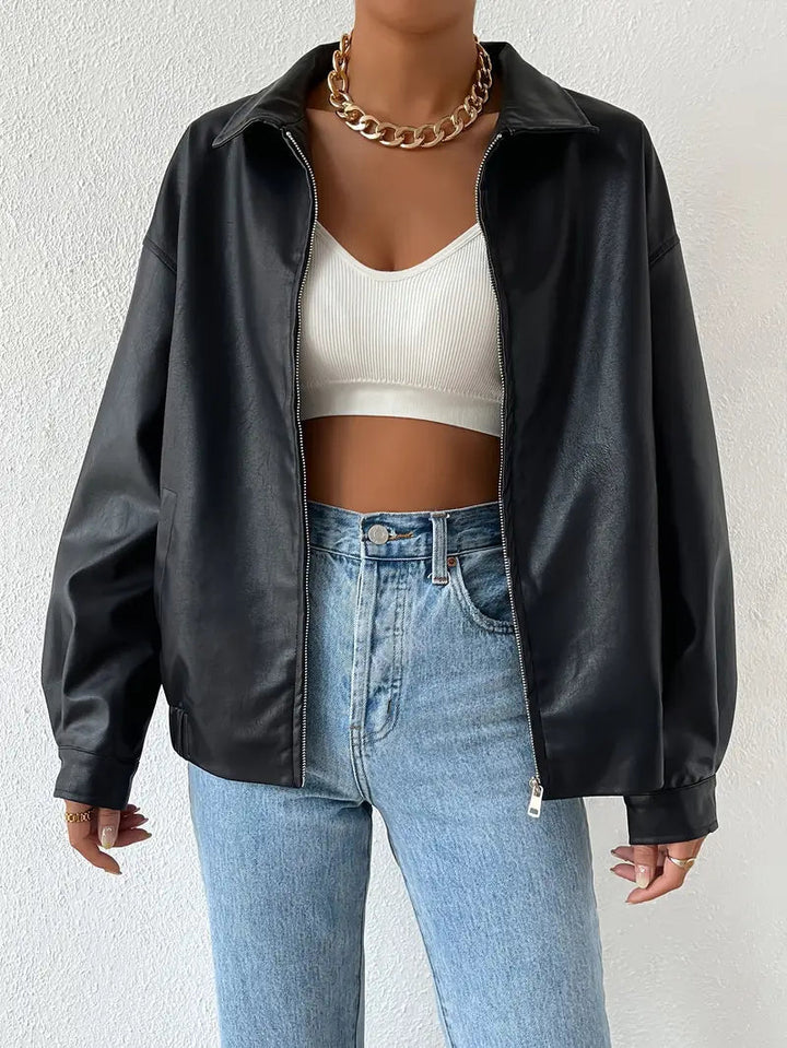 Stylish black zip-up moto jacket for women. Perfect winter outerwear and edgy fashion statement.