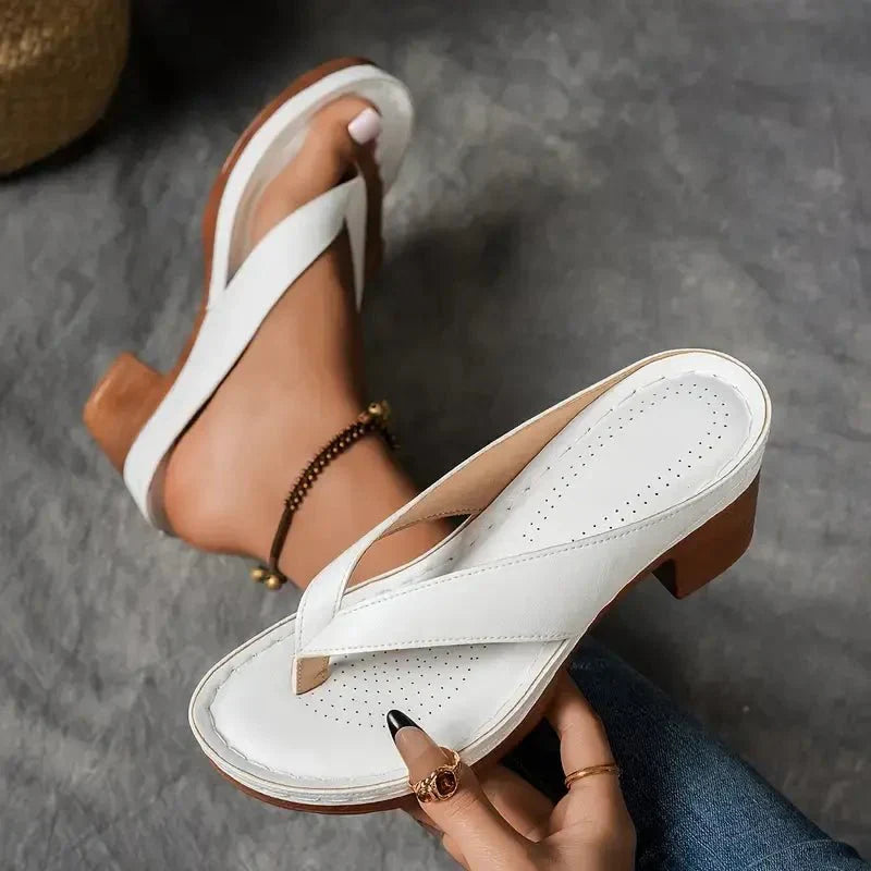 Black women's sandals with a discreet low heel, designed for ultimate orthopedic comfort.