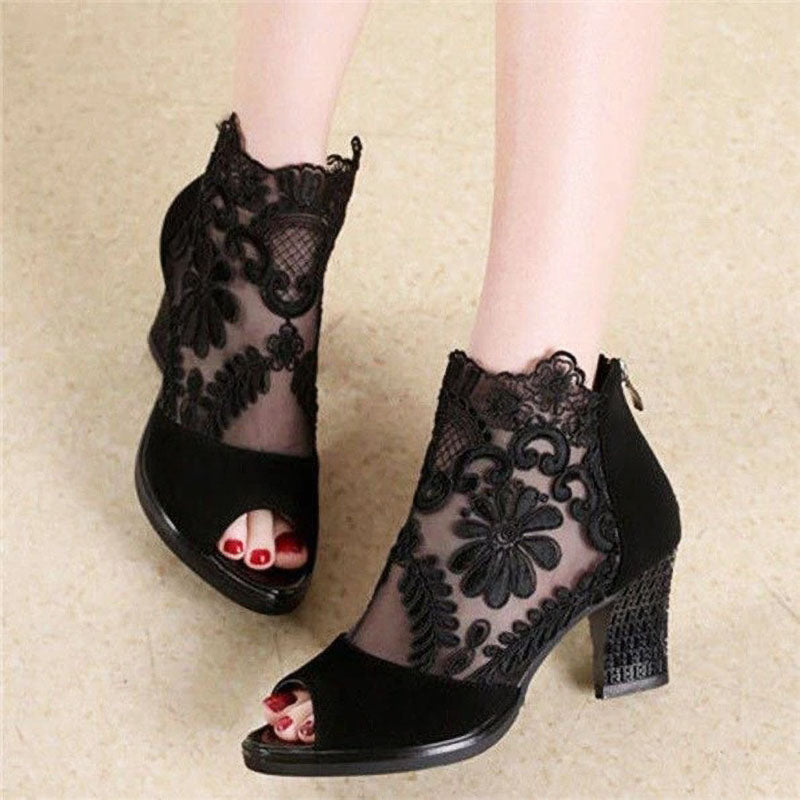 Women's black peep toe ankle heels with intricate floral detail, perfect for evening & party wear.