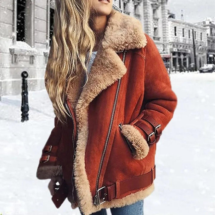 Fashionable orange women's winter jacket with adjustable belt & convenient pockets. Trendy cozy outerwear.