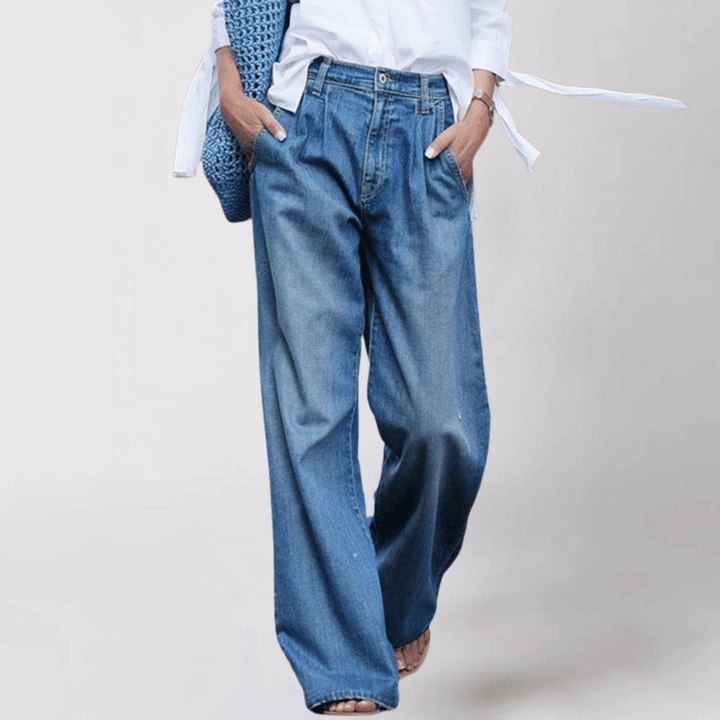 Stylish women's wide leg denim jeans in blue, offering effortless comfort & a flattering relaxed fit.
