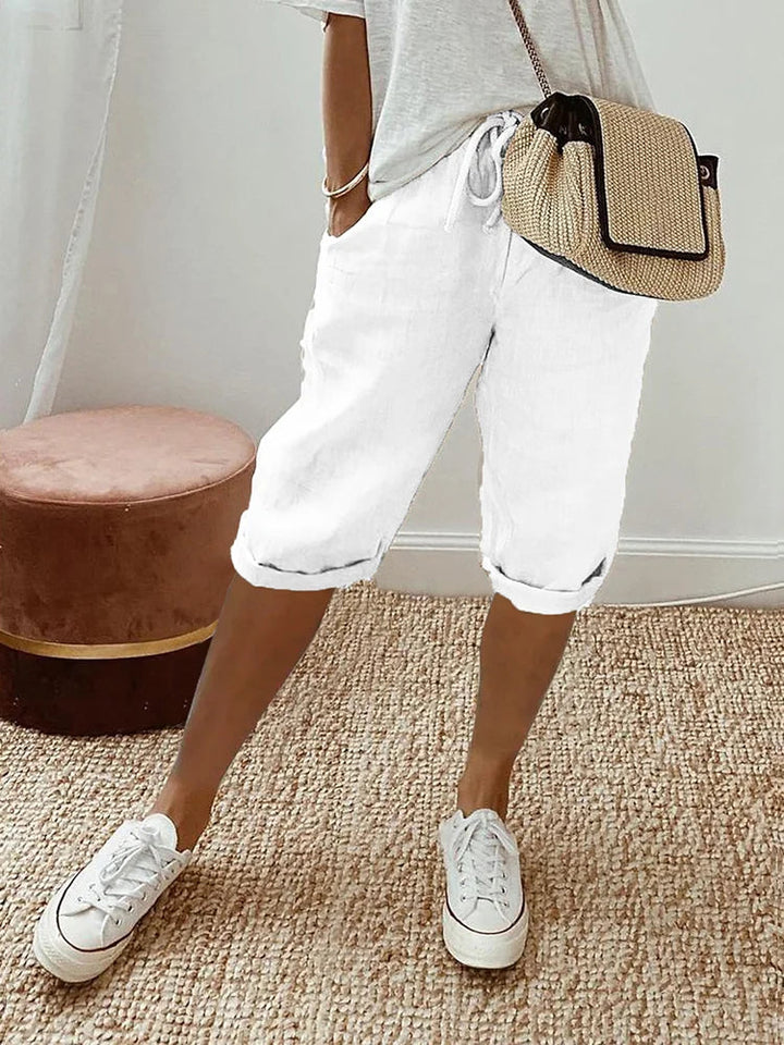 Close-up of women's breathable fabric knee-length pants, perfect for ultimate comfort & everyday summer wear.
