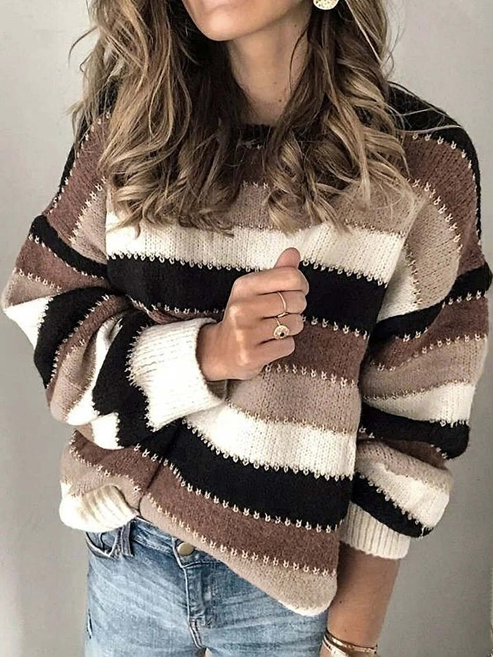 Women's brown striped knitted sweater with long sleeves & round neck. Cozy winter fashion, perfect for casual everyday wear.