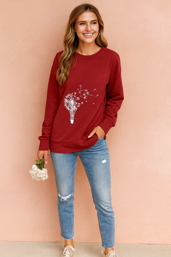 Stylish women's dandelion graphic print sweater. Long sleeve, casual top for effortless everyday fall & spring fashion.