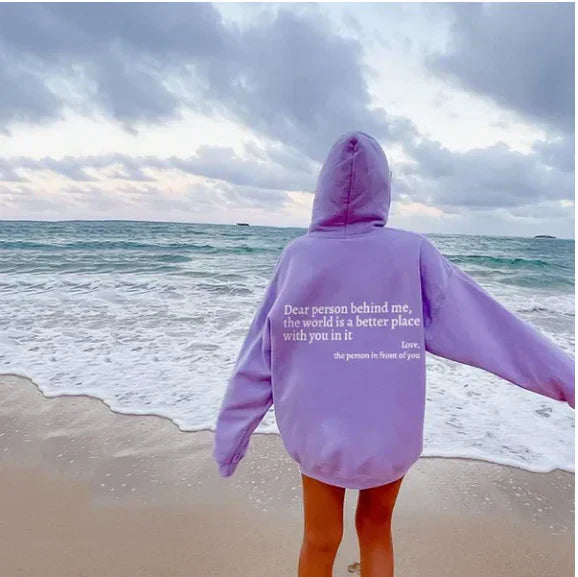 Close-up of a woman's cozy casual hoodie with a witty graphic message. Comfortable everyday pullover.