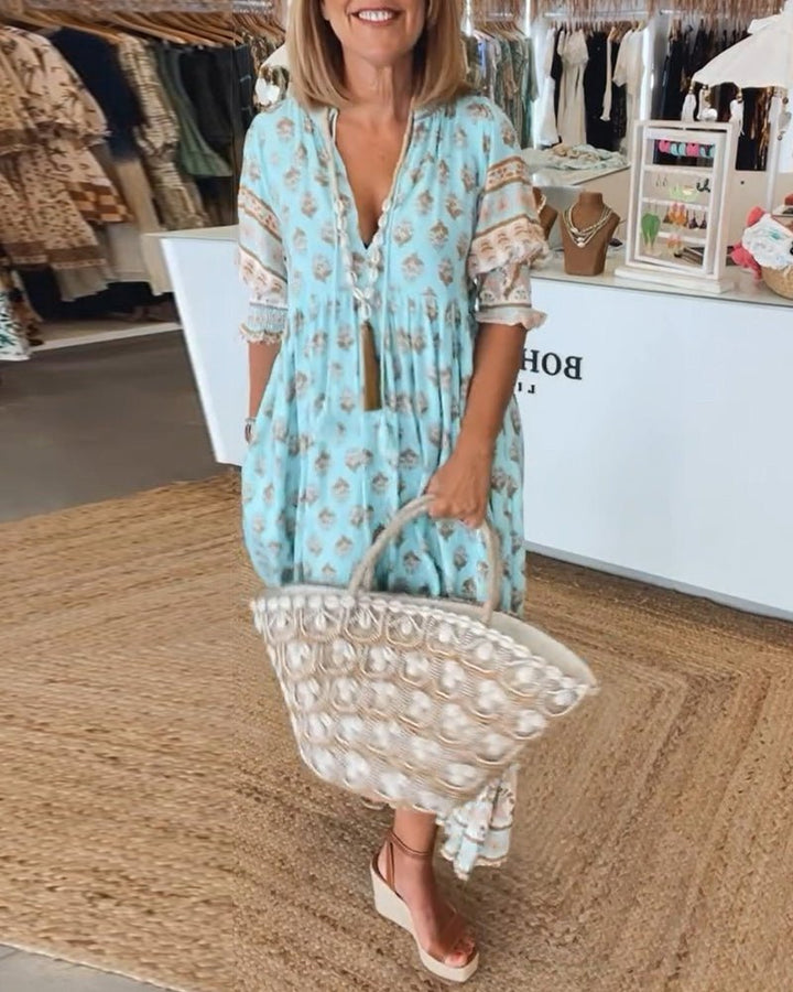 Women's chic floral V-neck maxi dress, elegant for everyday style.