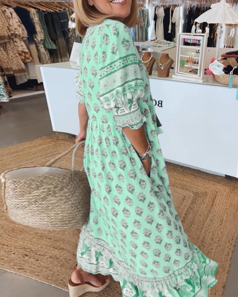 Elegant women's maxi dress, V-neck, with intricate floral design, perfect for any occasion.