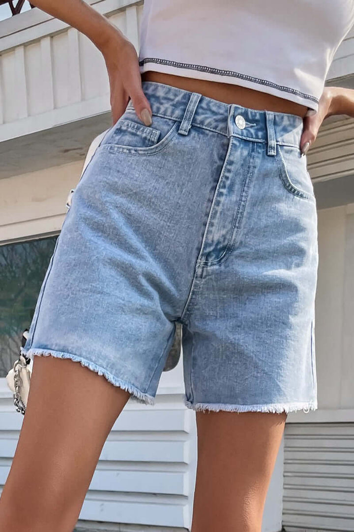 Women's chic solid denim shorts with raw hem, perfect for comfortable summer casual wear.