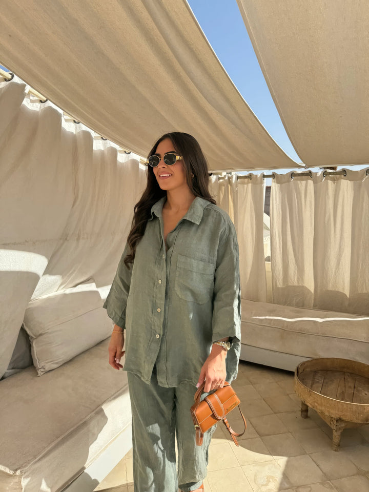 Complete women's summer outfit: a trendy long-sleeve top paired with wide-leg pants in a two-piece set.