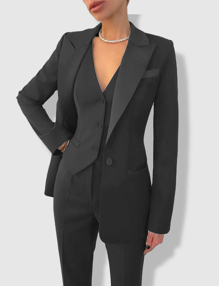 Women's classic tailored business suit with notch lapels. Professional blazer & trousers set for workwear.