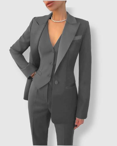 Stylish women's business blazer set. Tailored suit for professional wear, ideal for office or formal events.