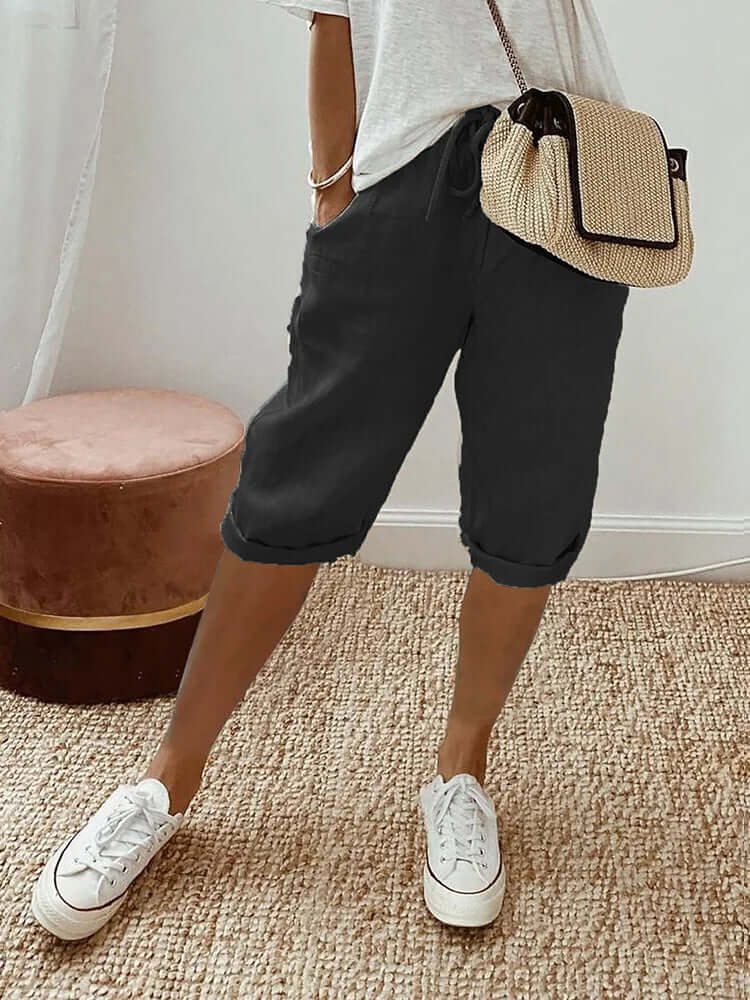 Women's comfortable knee-length drawstring pants, ideal for casual summer wear & everyday comfort.