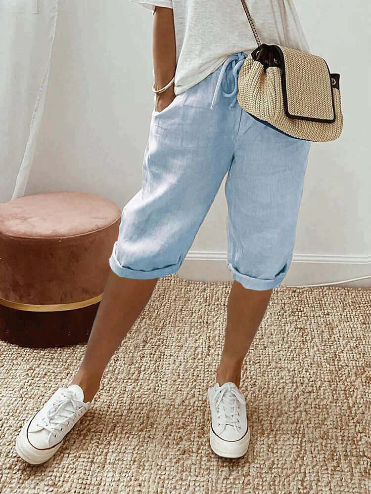 Versatile women's knee-length pants featuring a drawstring, great for casual outings & warm weather.