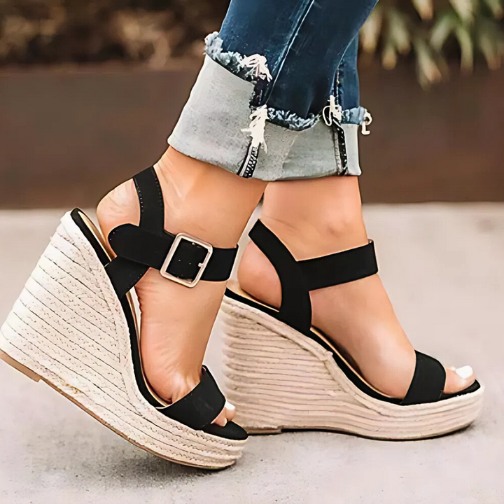Women's comfortable T-strap wedge sandals, perfect for summer casual wear. Features a stylish buckle strap and platform.