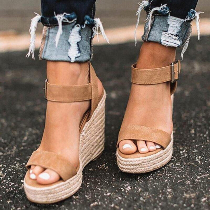 Stylish women's T-strap wedge sandals offering all-day comfort. Ideal summer casual footwear with a platform design.