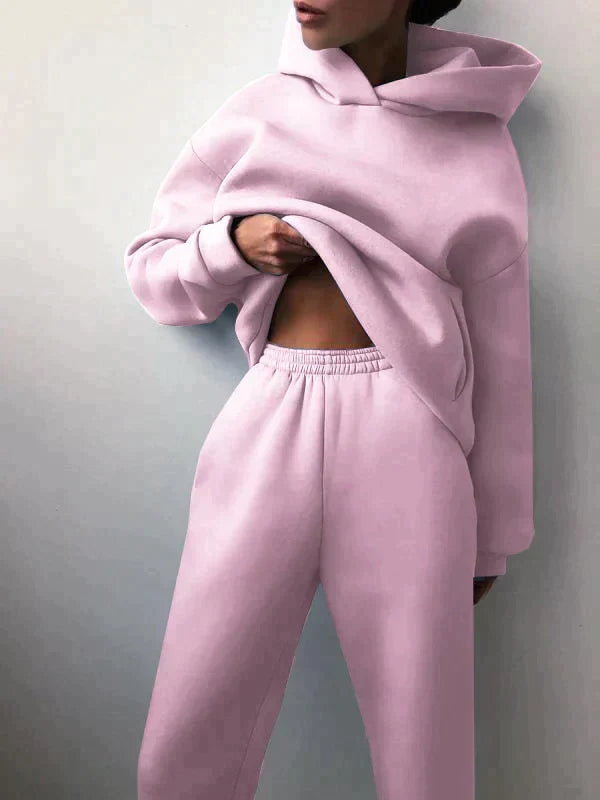 Cozy women's two-piece jogging set. Soft hoodie and pants for comfortable activewear or loungewear.