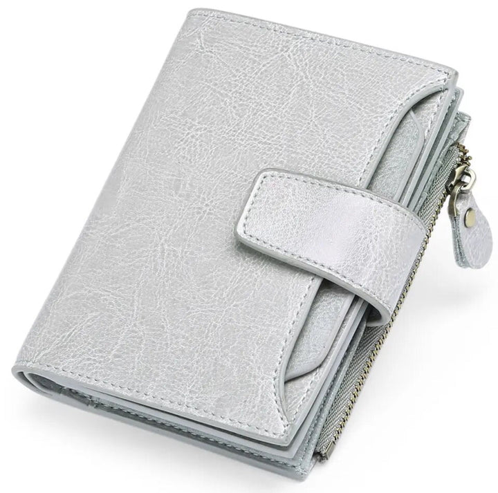 Women's genuine leather RFID wallet, compact and secure with space for cards and coins.