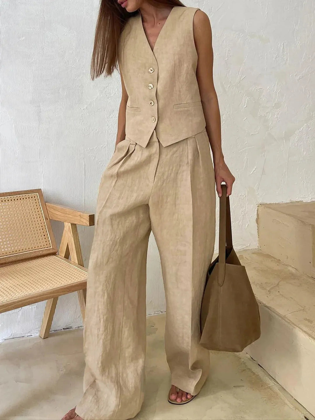 Breathable women's cotton linen two-piece summer set with a chic waistcoat and flowy wide-leg pants, relaxed.
