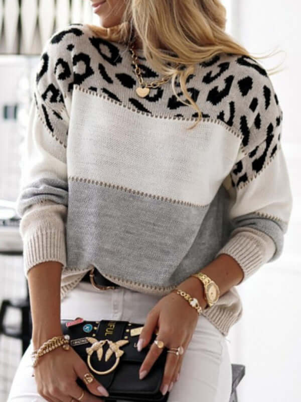 Cozy women's leopard print knitted sweater. Stylish animal print, long-sleeve top for winter fashion & casual comfort.