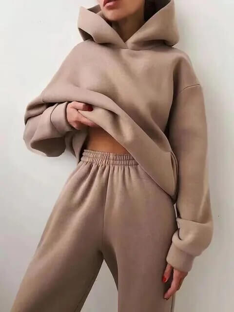 Women's versatile oversized tracksuit for activewear or casual outings. Cozy hoodie & matching pants.