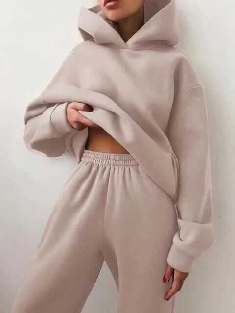 Two-piece women's oversized tracksuit set with a relaxed-fit hoodie & comfortable matching sweatpants.
