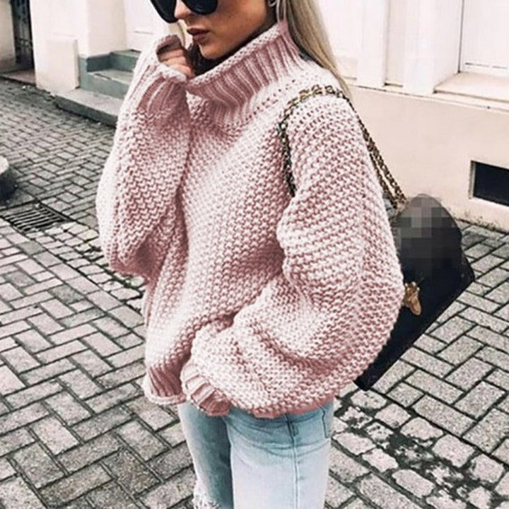 Comfortable women's knitted pullover jumper with a cozy oversized turtleneck for fall.
