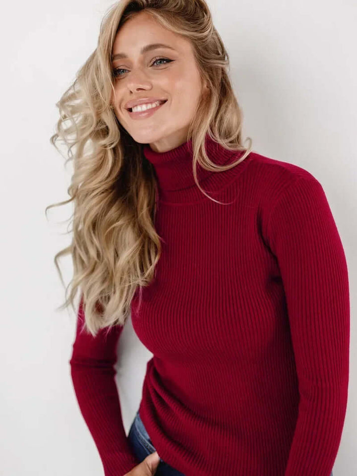 Effortless women's ribbed turtleneck pullover, a stylish and warm essential for fall & winter.