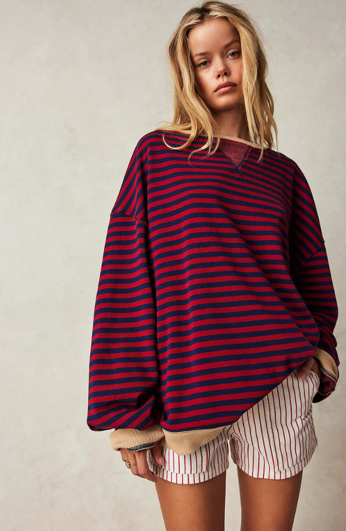 Women's fall fashion: a cozy striped crewneck sweater. Comfortable long sleeve knitwear for casual elegance.
